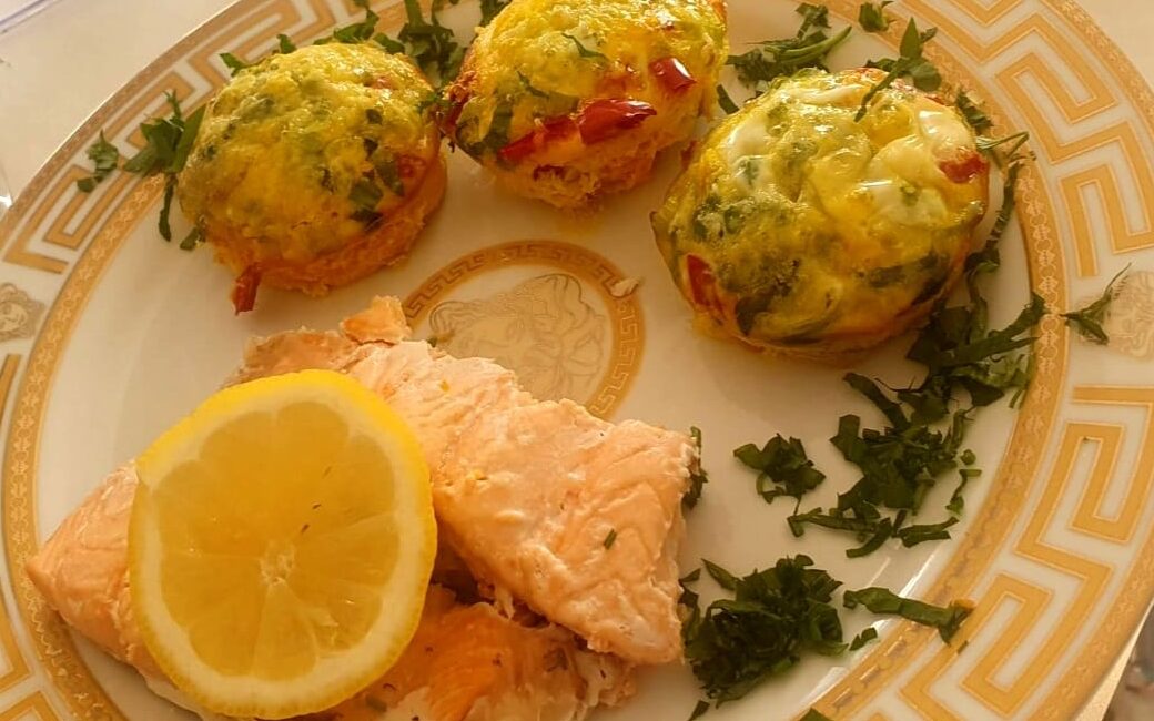 Sliced gently steamed salmon fillets with freshly grated ginger and blended pineapple juice, creating a delicate and flavorful dish. Seasoned with rosemary and a pinch of salt, this dish is served with lemon slices for a refreshing touch. Pair it with Cheesy Veggie Egg Muffins. Perfect for all ages, including toddlers!